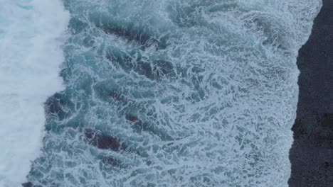 Top-Down-Drone-of-wave-action-at-low-tide-over-coral-and-rock-reef-Nyang-Nyang-Beach,-Bali,-Uluwatu-Indonesia