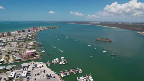 High-elevation-aerial-view-of-Fort-Myers-Beach-with-sailboats-anchored