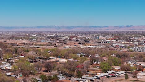 Telephoto-drone-shot-of-the-bridge-over-the-Colorado-River-in-Grand-Junction,-CO
