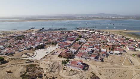 Panoramic-orbit-above-Culatra-Island-Olhao-Portugal-with-view-of-boats-and-harbor-port