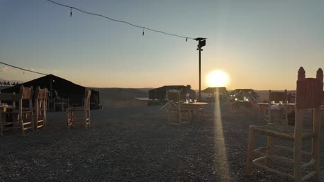 Agafay-Desert-bedouin-camp,-sunset-time-lapse,-golden-hour-Morocco