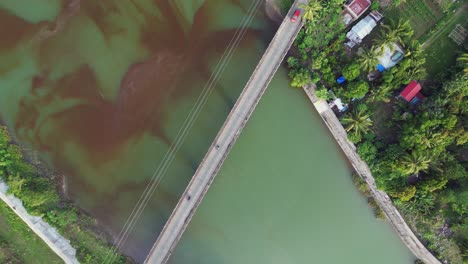 Cars-And-Motorcycles-Driving-Across-The-Bridge-Over-Pajo-River-In-Virac,-Catanduanes