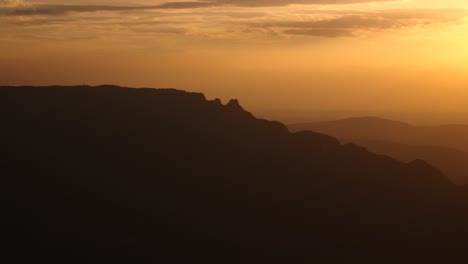 View-from-belvedere-Du-Revard,-mountain-valley,-hills-shadow-highlights,-Dent-du-Chat-at-sunset