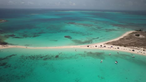 The-pristine-turquoise-waters-and-sandy-isthmus-of-cayo-de-agua,-los-roques,-aerial-view