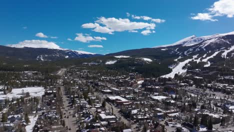 Drone-shot-over-downtown-Breckenridge,-Colorado-in-the-snowy-winter-months