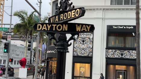 Beverly-Hills,-California-street-sign-on-Rodeo-Drive-for-Via-Rodeo-and-Dayton-Way