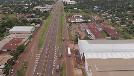Aerial-drone-footage-capturing-the-urban-infrastructure-of-Posadas,-Misiones,-Argentina,-showcasing-the-collectors-and-city-layout-from-a-unique-perspective