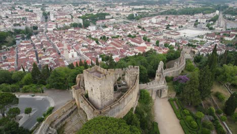 Convent-of-christ-in-tomar,-portugal,-with-surrounding-landscape-and-buildings,-aerial-view