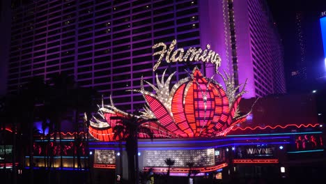 Flamingo-Casino-Hotel-on-Las-Vegas-Strip-at-Night,-Iconic-Logo-and-Lights