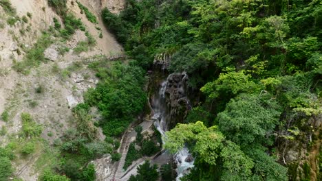 The-Tolantongo-River-and-La-Gloria-waterfall-in-Hidalgo-as-seen-from-the-Mezquital-Canyon,-Mexico