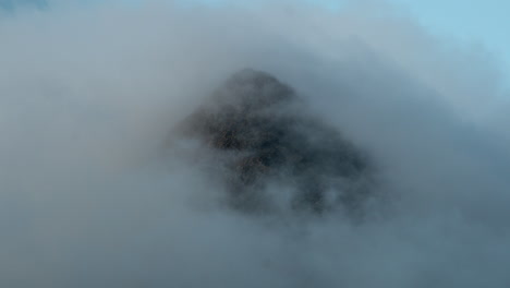 Timelapse-of-a-rocky-mountain-peak-hit-by-sunlight-and-clouds