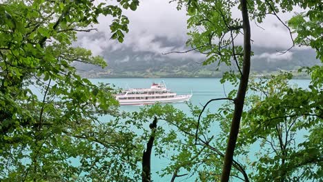 La-Suisse-steamboat-ship-on-Lake-Brienz-as-seen-from-Iseltwald-village-in-Switzerland-Europe-in-the-Spring