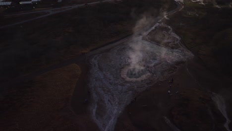 Aerial-orbiting-drone-shot-of-one-of-the-many-active-geyser-in-Iceland
