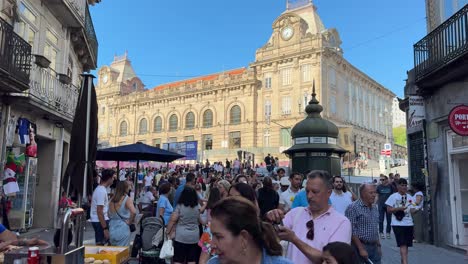 People-strolled-on-the-street-with-plastic-hammers-during-the-celebration-of-São-João-do-Porto,-Portugal