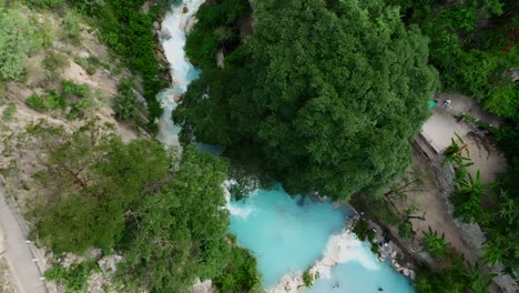 High-altitude-drone-aerial-of-Tolantongo-hot-springs-and-turquoise-water-in-Mexico’s-Mezquital-Canyon