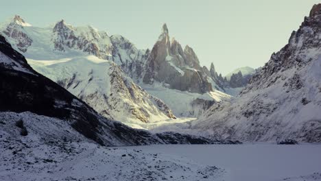 Close-up-static-view-of-Cerro-Torre-and-snow-covered-lake-in-Patagonia,-Argentina
