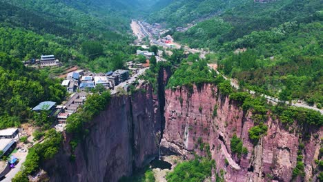 Aerial-establishing-shot-of-the-Huixian-city-built-above-the-Guoliang-tunnel,-China