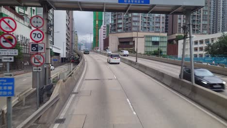 hongkong-busride-POV,-Hong-Kong-town-drivethrough,-city-traffic-on-highway