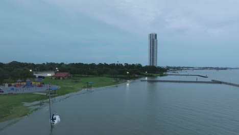 An-aerial-view-a-sailboat-run-aground-and-high-water-at-Clear-Lake-Park-due-to-Tropical-Storm-Alberto-in-Pasadena,-Texas