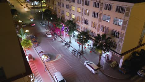 Aerial-establishing-shot-of-vibrant-nightlife-in-Boten,-Laos