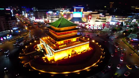 Establishing-aerial-view-of-illuminated-Bell-Tower-of-Xi'an-at-night,-circling