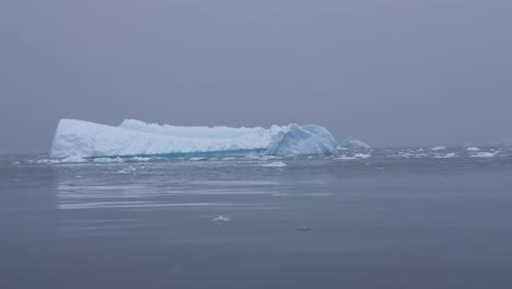 Iceberg-in-Cold-South-Pacific-Ocean-Water-Near-Coast-of-Antarctica,-Wide-View