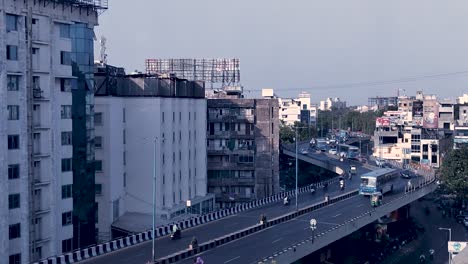Time-lapse-aerial-view-of-Fatehgunj-Bridge-in-Vadodara,-showing-vehicles-and-traffic