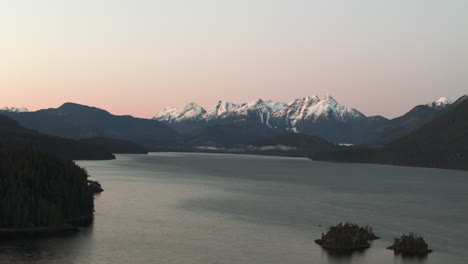 First-Light-on-Nimpkish-Lake:-Snow-Covered-Peaks-and-Tranquil-Water