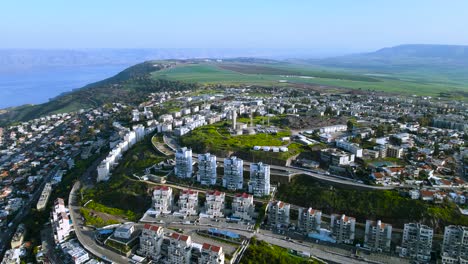 Tiberias-and-the-Sea-of-Galilee,-at-sunset,-a-drone-shot