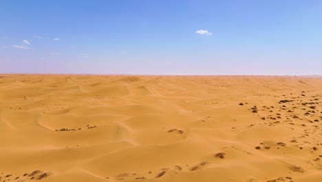 Aerial-shot-of-the-barren-Tengger-Desert-with-large-sand-hills-in-China