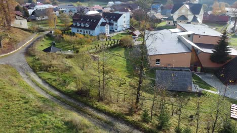 Drone-view-of-mountain-village-with-church-and-surrounding-hills