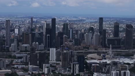 Skyline-skyscraper-cranes-Brissy-Brisbane-City-River-South-Bank-Park-Quay-ferry-boat-Australia-aerial-drone-Glass-House-Mountains-grey-cloudy-morning-summer-autumn-winter-Aussie-backwards-motion