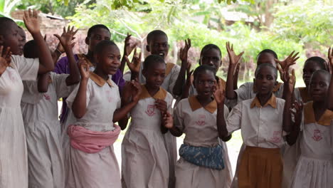 Uganda-children-performing-traditional-dance-wearing-school-uniform