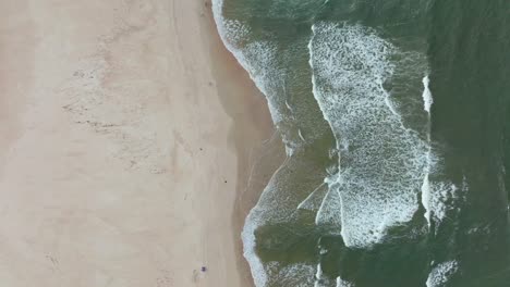 Walking-on-sandy-ocean-rip-tide-Bribie-Island-Kings-Beach-Sunshine-Coast-aerial-drone-cloudy-sun-summer-autumn-winter-Australia-Australian-Aussie-beautiful-Queensland-Caloundra-coastline-static-shot