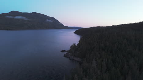 Nimpkish-Lake-Sunrise:-Lush-Forested-Peaks-and-Golden-Horizons