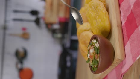 Sopaipillas-and-Pebre-fiestas-patrias-Chile-kitchen-vertical-Spoon