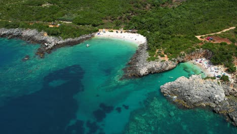 Scenic-Beach-with-Calm-Turquoise-Water-and-White-Sand,-Popular-Among-Tourists-on-Albania's-Treasure-Filled-Coastline