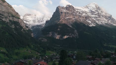 Descending-Shot-in-Grindelwald-Valley-at-Sunset-with-Swiss-Peaks