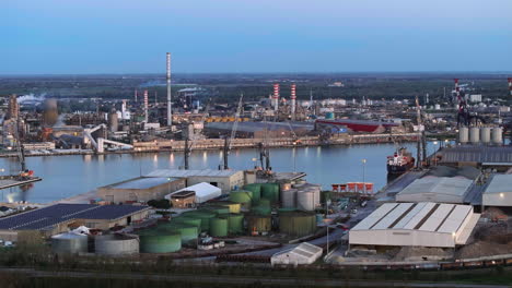 Industrial-and-port-area-of-Ravenna-,chemical-and-petrochemical-pole,thermoelectric,metallurgical-plants-and-hydrocarbon-refinery-and-liquefied-natural-gas-tanks,shot-at-evening