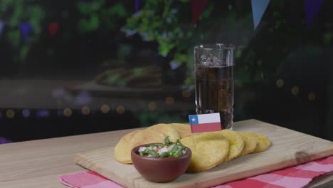 Sopaipillas-and-Pebre-fiestas-patrias-Chile-kitchen-serving-pisco-traditional-drink