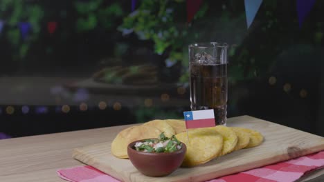 Sopaipillas-And-Pebre-Fiestas-Patrias-Chile-Kitchen-Serving-Pisco-Traditional-Drink