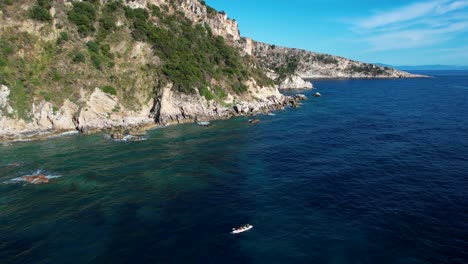 Kayaking-Tourists-Navigate-the-Blue-Waters-of-the-Ionian-Sea-Along-Albanian-Coastline-Cliffs