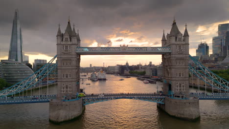 A-blue-light-run-ambulance-on-an-emergency-call-crosses-Tower-Bridge-in-London