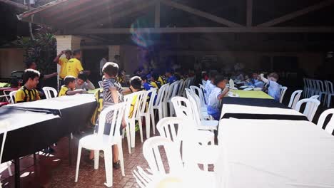 Children-from-different-sports-teams-having-lunch-together-after-a-tournament