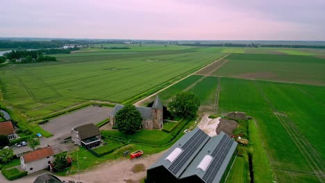 The-historic-village-church-of-the-Sint-Antonius-Polder-in-the-Netherlands,-founded-in-the-16th-century,-side-view-and-front-view