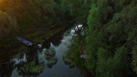 Aerial-view-tilting-over-a-river-in-middle-of-vegetation-of-Skadar-lake,-Montenegro