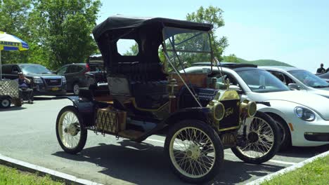 Historical-Vintage-Ford-Automobile-Parked-With-Modern-Generation-Cars