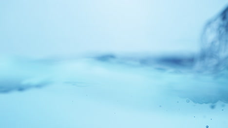 Water-waves-on-surface-with-blue-background_slow-motion