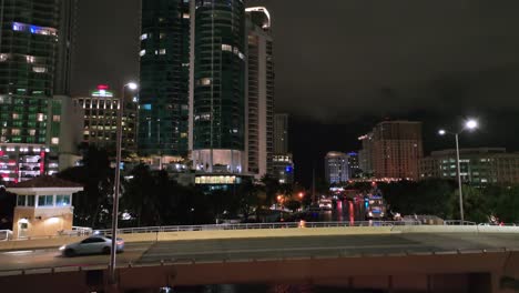 Rising-drone-shot-of-lighting-Downtown-Skyline-of-Fort-Lauderdale,-Florida