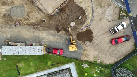 Excavator-digging-on-construction-site-in-city-during-sunny-day